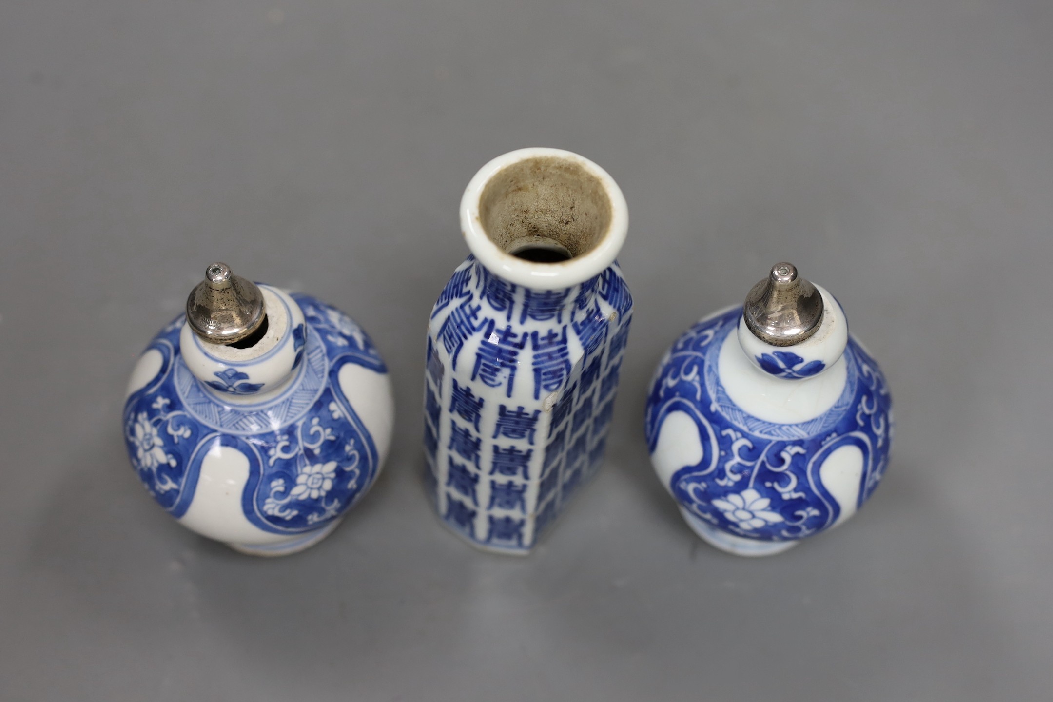 A pair of Chinese Kangxi blue and white rose water sprinklers (cut down) and an unusual 19th century Chinese blue and white ‘Hundred Shou’ jar, rose sprinklers: 10cms high excluding metal tops